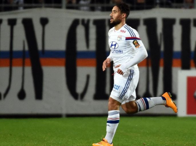 Lyon's French midfielder Nabil Fekir reacts after scoring a goal during the French L1 football match between Montpellier and Lyon on March 8, 2015 at the La Mosson Stadium in Montpellier, southern France. AFP PHOTO / PASCAL GUYOT