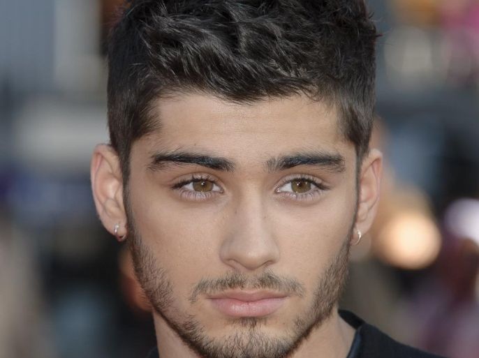 File - Zayn Malik flies home from One Direction tour with stress in this Tuesday, Aug. 20, 2013 file photo Zayn Malik arrives for the UK Premiere of 'One Direction: This Is Us 3D' at a central London cinema, (Photo by Jonathan Short/Invision/AP, file)
