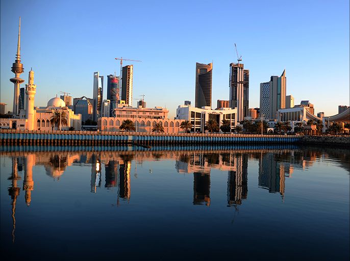 epa03092791 (FILE) A file picture dated 06 December 2011, shows the Kuwaiti parliament (R) and other buildings reflected in Arabian Gulf water, in Kuwait City, Kuwait. According to media reports, the Kuwaiti government resigned on on 05 February 2012, four days after the Islamist-led opposition made major gains in the Gulf country's early parliamentary elections.A new government is expected to be created before parliament holds its first session in less than two weeks. EPA/RAED QUTENA