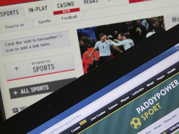 The Ladbrokes (top) and PaddyPower Sport betting websites are seen on electronic devices in this file picture illustration taken in Paris May 22, 2014. On the websites of Britain's bookmakers gamblers can bet around the clock on anything from soccer in Azerbaijan to financial market fluctuations, while others in betting shops feed high-stake machines that can devour 300 pounds ($470) a minute. This anywhere, anytime gambling culture has changed the face of the industry over the past 15 years and brought fresh temptations to those who struggle to prevent a harmless flutter from becoming a dangerous addiction. To match story GAMBLING-ADDICTION/ REUTERS/Christian Hartmann/Files (FRANCE - Tags: SOCIETY BUSINESS HEALTH SCIENCE TECHNOLOGY)