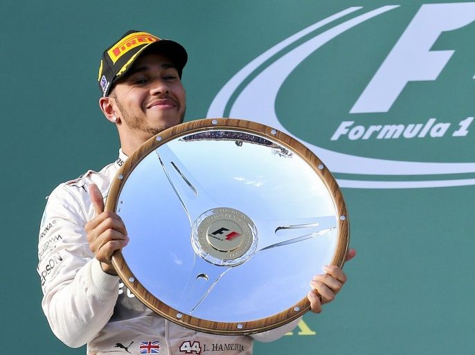 British Formula One driver Lewis Hamilton of Mercedes AMG GP holds the trophy after winning the Formula One Grand Prix of Australia at the Albert Park circuit for the Australian Formula One Grand Prix in Melbourne, Australia, 15 March 2015.