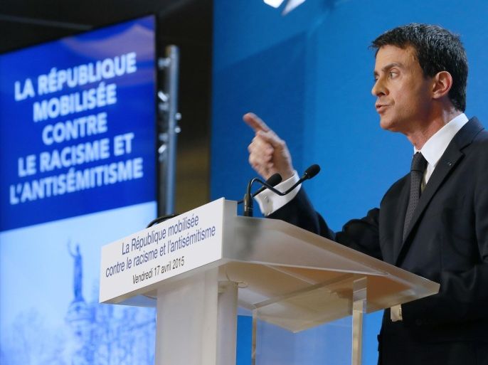 French Prime Minister Manuel Valls presents the government's plan aimed at figthting Racism and anti-Semitism at the Val-de-Marne Prefecture in Creteil, south-eastern Paris suburb, on April 17, 2015. AFP PHOTO / PATRICK KOVARIK