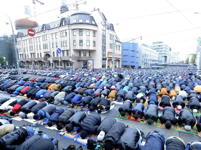 MOSCOW, RUSSIA - OCTOBER 4: Muslims living in Moscow perform Eid al-Adha prayer at the square and streets surrounding the Central Mosque located near the Prospekt Mira subway station, Moscow, Russia on October 4, 2014.