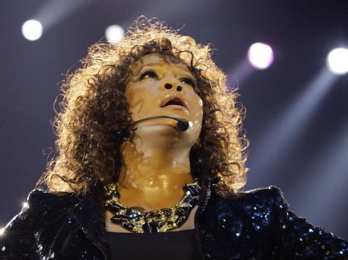 FILE - In this Sunday, April 25, 2010, file photo, U.S singer Whitney Houston performs in London as part of her European tour. Houston, 48, died Feb. 11, 2012. (AP Photo/Joel Ryan, File)