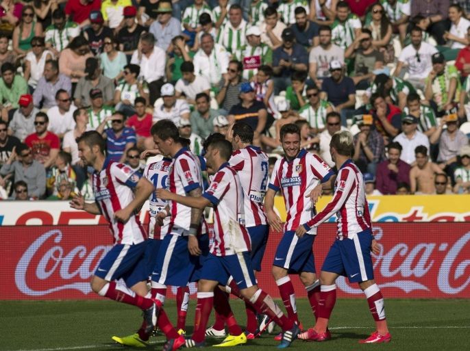 Atletico Madrid's players celebrates after scoring against Cordoba during the Spanish Liga Primera Division soccer match played at Sanchez Pizjuan stadium, in Sevilla, southern Spain, 04 April 2015.