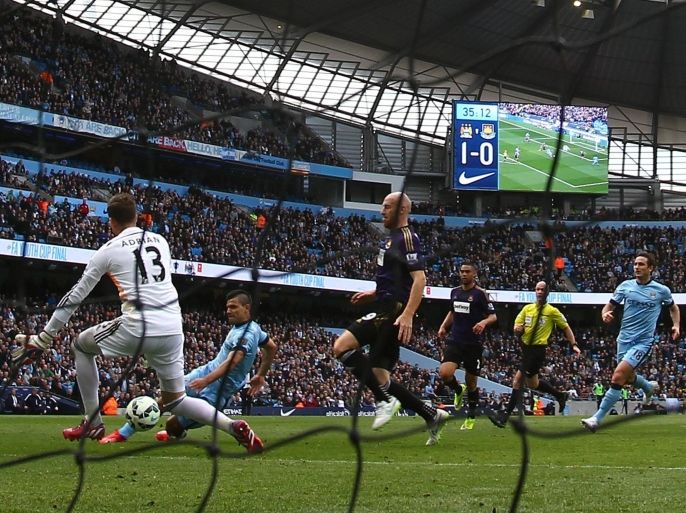 MANCHESTER, ENGLAND - APRIL 19: Sergio Aguero of Manchester City scores their second goal past Adrian of West Ham during the Barclays Premier League match between Manchester City and West Ham United at Etihad Stadium on April 19, 2015 in Manchester, England.