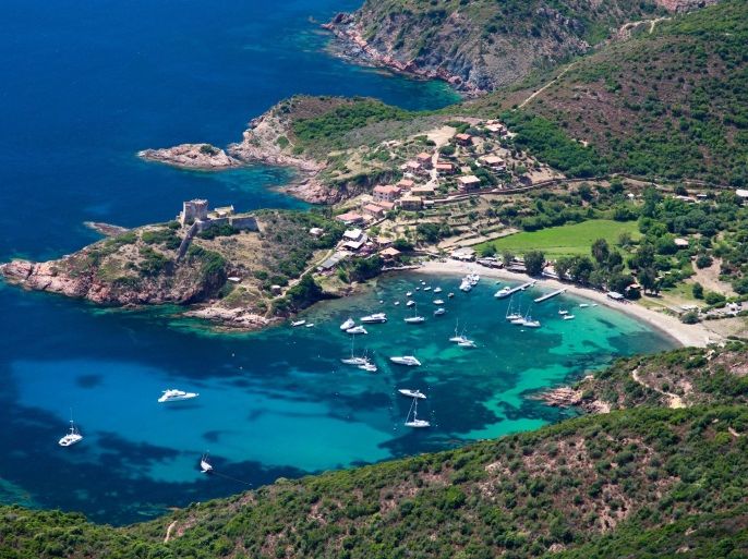 An aerial view taken on July 1rst, 2013, shows the port of Girolata Osani, in the natural reserve of Scandola, on the French Mediterranean Island of Corsica.