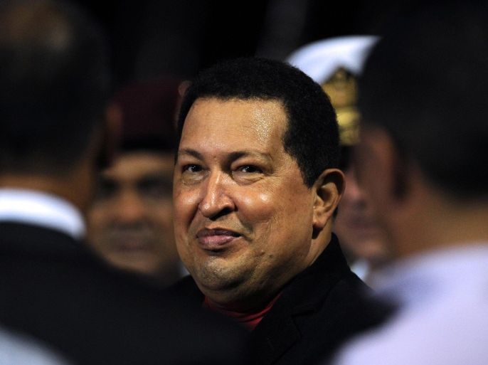 Venezuelan President Hugo Chavez is welcomed with military honours at Caracas' Maiquetia international airport on March 16, 2012 after spending three weeks in Cuba where he underwent cancer surgery. Chavez underwent surgery in Havana on February 26 to remove a cancerous tumor around the pelvis, the same area where a first tumor was extracted in June 2011.