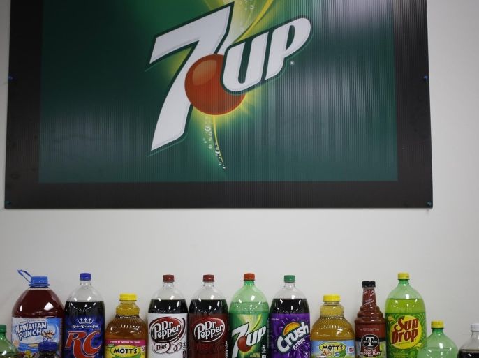 Dr. Pepper Snapple Bottling Group soft drinks are displayed for a photograph at the company's warehouse in Louisville, Kentucky, U.S., on Tuesday, April 21, 2015. Dr. Pepper Snapple Group Inc., producers of 7up and A&W Root Beer, is scheduled to release earnings figures on April 23.