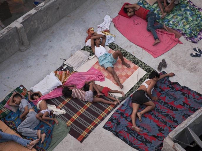 FILE - In this May 29, 2015 file photo, Indians sleep on the roof of a house to beat the heat in New Delhi, India. Even for a world getting used to wild weather, May seems stuck on strange. Torrential downpours in Texas, whiplashing the region from drought to flooding. A heatwave that has already killed more than 1800 in India and is the fifth deadliest since 1900. Record 91 degree temperature in of all places Alaska. A pair of top-of-the-scale typhoons in the Northwest Pacific. And a drought in the U.S. East is starting to take root just as the one ends in Texas. (AP Photo/Tsering Topgyal, File)