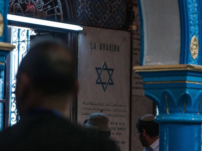 Jewish pilgrims gather at the Ghriba synagogue, the oldest Jewish monument built in Africa more than 2,500 years ago, to attend the annual Jewish pilgrimage in the resort of Djerba, Tunisia, Friday April 26, 2013. Jews coming from Tunisia, Europe or Israel make their annual pilgrimage to El Ghriba synagogue, commemorating the death of Shimon Bar Yohai, a second-century kabbalistic rabbi who authored a famous religious text known as The Zohar. (AP Photo/Aimen Zine)