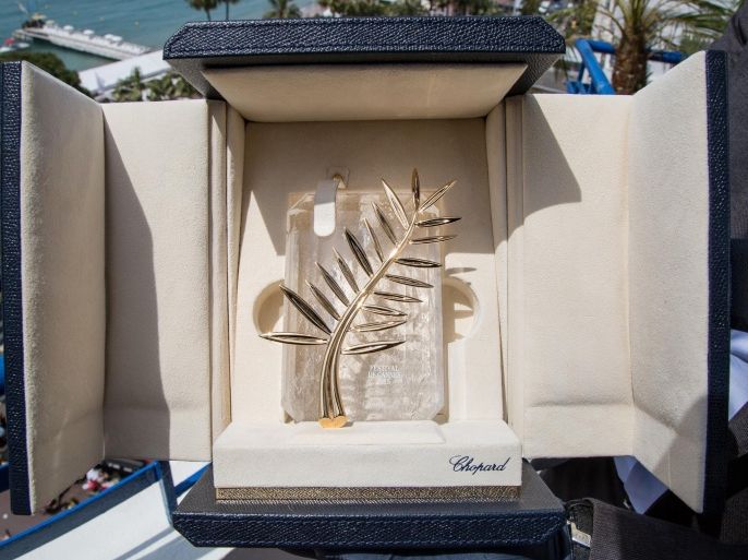 A person holds up a box containing the Palme d'Or award, which will be presented on Sunday, at the 68th international film festival, Cannes, southern France, Saturday, May 23, 2015. (Photo by Vianney Le Caer/Invision/AP)