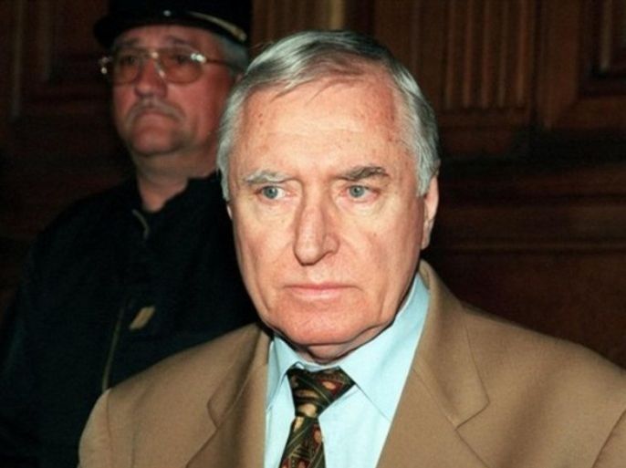 French mercenary Bob Denard, whose real name is Gilbert Bourgeaud, is seen at the beginning of his trial on Tuesday, May 4, 1999, in Paris for the 1989 assassination of Comoros president Ahmed Abdallah. Denard, a French former mercenary who led uprisings across Africa and the Middle East and controlled Comoros for more than a decade, has died, his family said Sunday, Oct 14, 2007. He was 78.