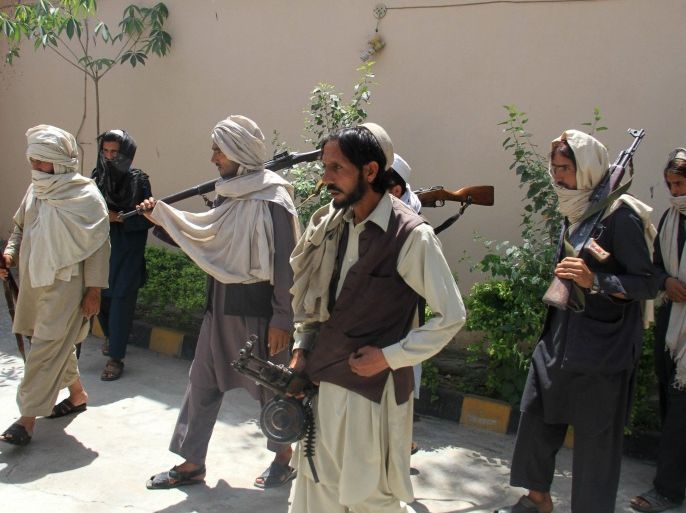 Former Taliban militants surrender their weapons during a reconciliation ceremony in Jalalabad, Afghanistan, 09 May 2015. The group of former Taliban militants laid down their arms in Jalalabad and joined the peace process. Under an amnesty launched by the former President Hamid Karzai and backed by the US in November 2004, hundreds of anti-government militants have so far surrendered to government.