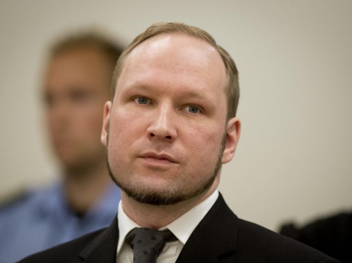 A picture taken on August 24, 2012 shows self-confessed mass murderer Anders Behring Breivik arriving in court room 250 at the central court Oslo to be sentenced for his twin attacks last year that left 77 people dead, bringing to a close one of the most spectacular trials in Norway's history. The Norwegian prison where Anders Behring Breivik is being held said on August 1, 2013 it agreed in principle to allow the convicted mass murderer to study political science, if the university wants him.