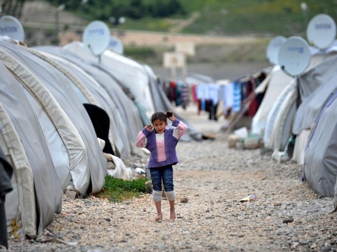 GAZIANTEP, TURKEY - APRIL 15: A Syrian kid fled from the civil war, living in a refugee camp is seen in Nizlip district of Gaziantep, Turkey on April 15, 2015.