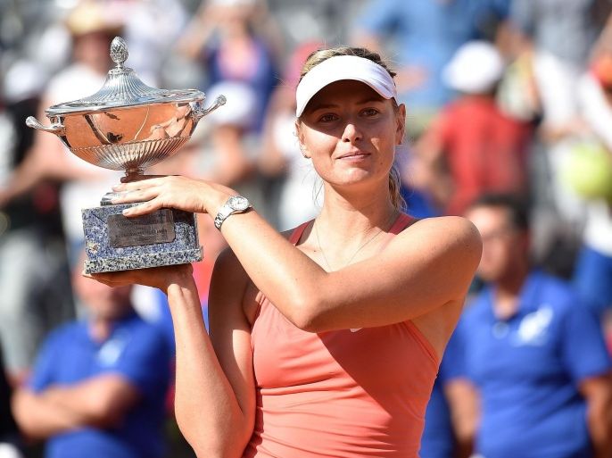 ROME, ITALY - MAY 17: Maria Sharapova of Russia holds up the trophy after defeating Carla Suarez Navarro of Spain in their women's singles final match at The Internazionali BNL d'Italia 2015 tennis tournament at the Foro Italico on May 17, 2015 in Rome, Italy.