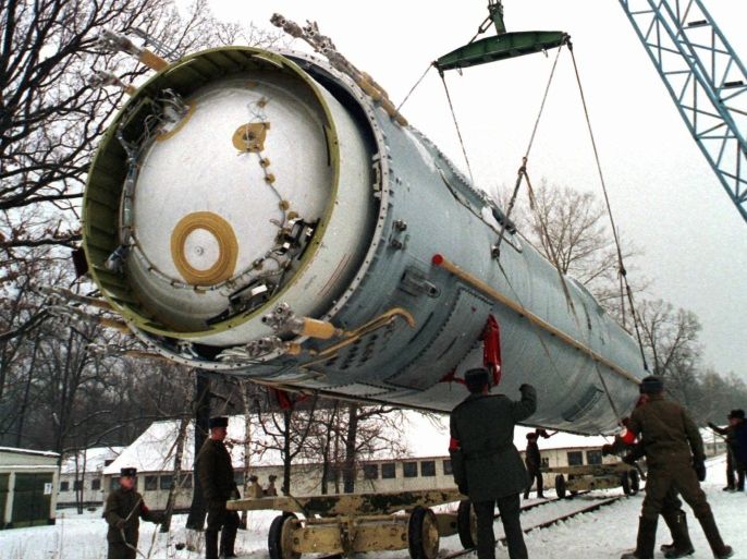 FILE - In this Dec. 24, 1997 file photo, soldiers prepare to destroy a ballistic SS-19 missile in the yard of the largest former Soviet military rocket base in Vakulenchuk, Ukraine. The Obama administration is weighing a range of aggressive responses to Russia’s alleged violation of a Cold War-era nuclear missile treaty, including deploying land-based missiles in Europe that could pre-emptively destroy the Russian weapons. This “counterforce” option is among possibilities the administration is discussing as it reviews its entire policy toward Russia in light of Moscow’s military intervention in Ukraine, its annexation of Crimea and other confrontational actions in Europe and beyond. The options go so far as one implied -- but not stated explicitly -- that would improve the ability of U.S. nuclear weapons to destroy military targets on Russian territory. (AP Photo, File)