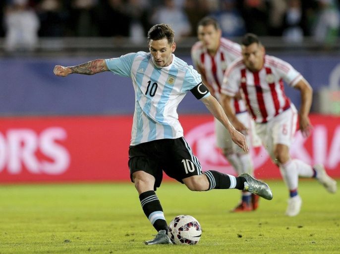 Argentinian Lionel Messi scores a penalty kick during the Copa America 2015 Group B soccer match between Argentina and Paraguay, at Estadio La Portada de La Serena in La Serena, Chile, 13 June 2015.
