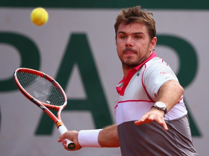 PARIS, FRANCE - JUNE 02: Stanislas Wawrinka of Switzerland plays a forehand in his Men's quarter final match against Roger Federer of Switzerland on day of the 2015 French Open at Roland Garros on June 2, 2015 in Paris, France.