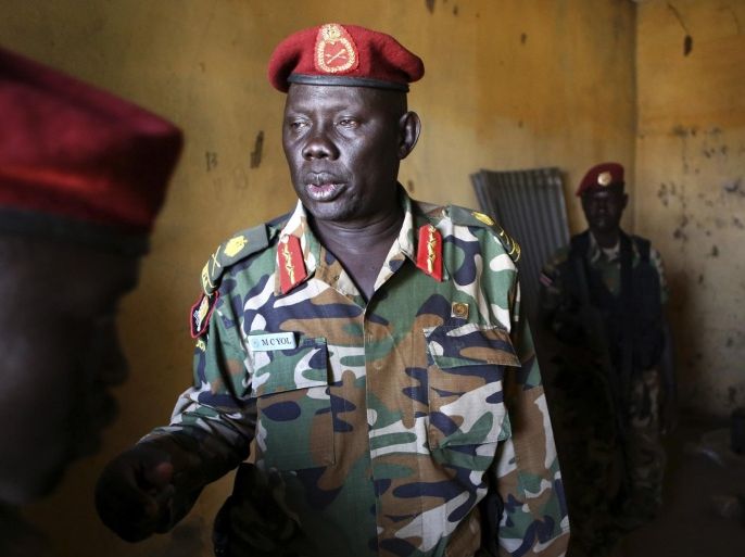 SPLA Major General Marial Chanuong Yol visits an ammunition storage room which was attacked by rebel soldiers last week, in Juba December 21, 2013. African mediators sought on Saturday to meet rivals to South Sudan's president in a bid to end fighting that threatens to drag the world's newest country into an ethnic civil war. REUTERS/Goran Tomasevic (SOUTH SUDAN - Tags: CIVIL UNREST POLITICS MILITARY)