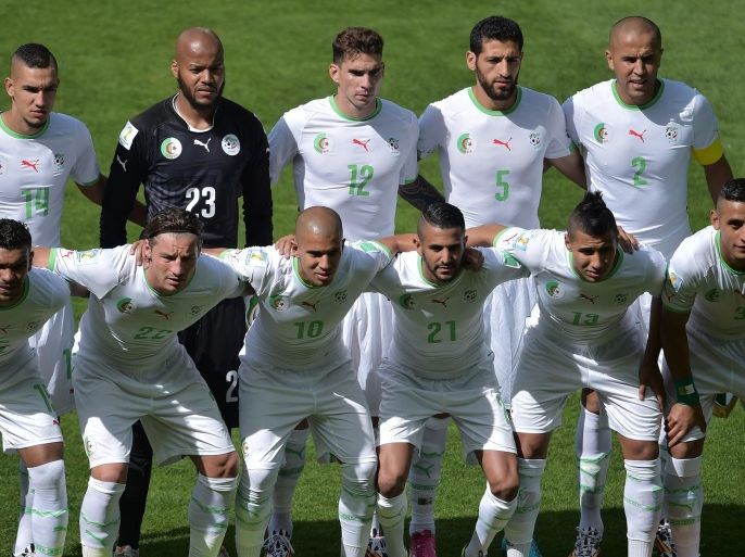 Algerian team (Top Row L-R) Algeria's midfielder Nabil Bentaleb, Algeria's goalkeeper Rais Mbohli, Algeria's defender Carl Medjani, Algeria's defender Rafik Halliche, Algeria's defender Madjid Bougherra. (Bottom Row L-R) Algeria's forward El Arabi Soudani, Algeria's defender Aissa Mandi, Algeria's forward Sofiane Feghouli, Algeria's forward Riyad Mahrez, Algeria's midfielder Saphir Taider, Algeria's defender Faouzi Ghoulam are pictured before the start of the Group H football match between Belgium and Algeria at the Mineirao Stadium in Belo Horizonte during the 2014 FIFA World Cup on June 17, 2014. AFP PHOTO / GABRIEL BOUYS