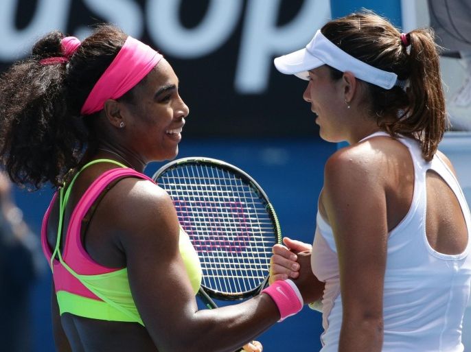 Serena Williams of the U.S., left, shakes hands with Garbine Muguruza of Spain after winning their fourth round match at the Australian Open tennis championship in Melbourne, Australia, Monday, Jan. 26, 2015. (AP Photo/Rob Griffith)
