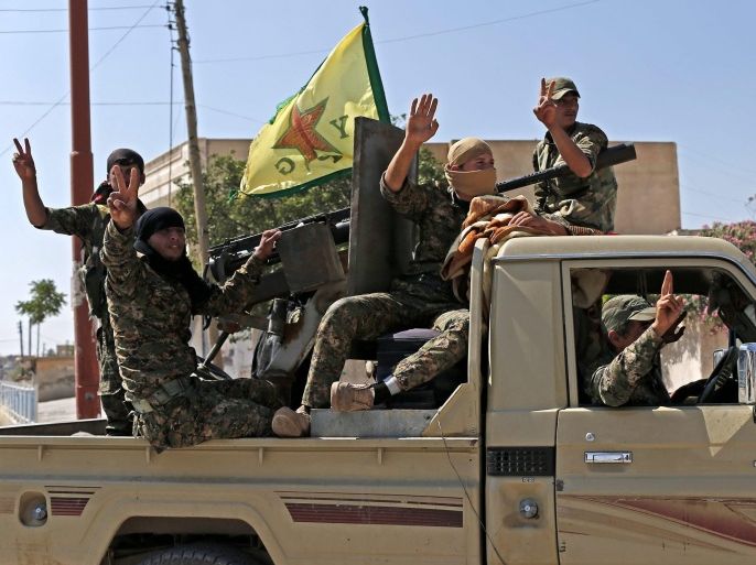 Members of Kurdish People Defence Units (YPG) flash victory sign after coming from Syrian town of al-Raqqa, in Tel Abyad, Syria, 23 June 2015. Kurdish fighters backed by US-led airstrikes captured a strategic town from Islamic State on 23 June as they pushed towards the extremist group's Syrian heartland. The Kurdish People's Protection Units (YPG) and allied rebels took complete control of the town of Ain Issa, bringing them within 50 kilometres of Islamic State's de facto Syrian capital of al-Raqqa, the Syrian Observatory for Human Rights said.