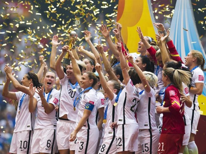 USA team players celebrate their win with the tropy at the end of the FIFA Women's World Cup 2015 final match between USA and Japan, at BC Place Stadium in Vancouver, Canada, 05 July 2015. EPA/BEN NELMS EDITORIAL USE ONLY, NOT USED IN ASSOCATION WITH ANY COMMERCIAL ENTITY - IMAGES MUST NOT BE USED IN ANY FORM OF ALERT OR PUSH SERVICE OF ANY KIND INCLUDING VIA MOBILE ALERT SERVICES, DOWNLOADS TO MOBILE DEVICES OR MMS MESSAGING