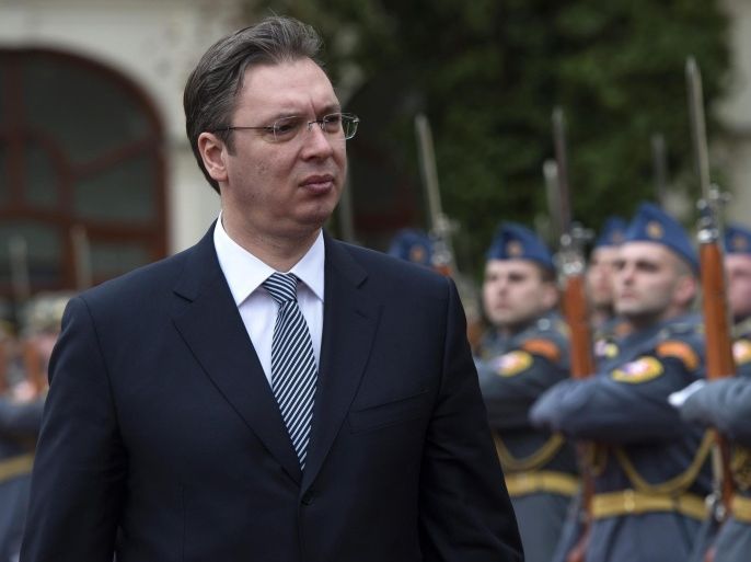 Serbia's Prime Minister Aleksandar Vucic (L) inspects a military honor guard in Bratislava, Slovakia, on April 2, 2015, during a meeting with the Slovakian Prime Minister. Serbia's Prime Minister Vucic arrived for a one-day offical visit in Slovakia. AFP PHOTO / SAMUEL KUBANI