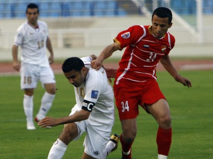 Lebanon's Al-Nejmeh club player Abbas Atwi runs ahead of Syria's Al-Ittiad club opponent Obaid Al-Salal during their AFC Cup football match in Beirut on April 6, 2010.