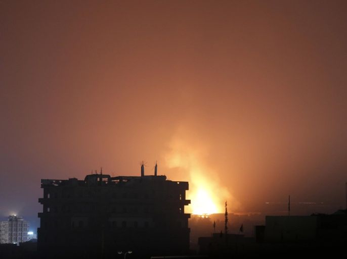 Fire and smoke rises after a Saudi airstrike in Sanaa, Yemen, Monday, July 13, 2015. Airstrikes by the Saudi-led coalition targeting Shiite rebels and their allies struck several Yemeni cities on Sunday, with combat raging near the strategic Bab el-Mandeb strait despite a declared truce, military and security officials said. (AP Photo/Hani Mohammed)