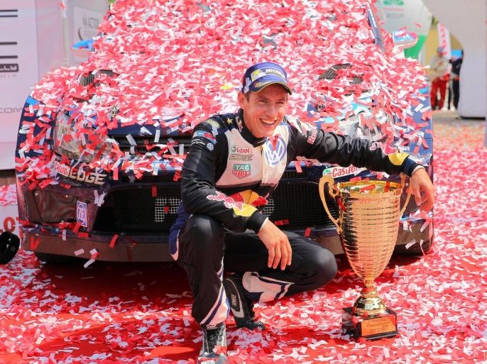 Sebastien Ogier of France celebrates with the trophy on the podium after winning the Rally of Poland 2015 as part of the World Rally Championship (WRC) in Mikolajki, Poland, 05 July 2015. EPA/TOMASZ WASZCZUK POLAND OUT