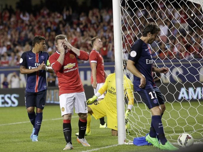 Manchester United forward Wayne Rooney (C) reacts after missing a goal against Paris Saint-Germain during the second half of their International Champions Cup soccer game at Soldier Field in in Chicago, Illinois on July 29, 2015. AFP PHOTO/ JOSHUA LOTT