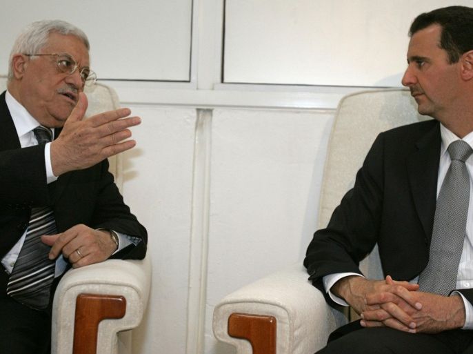 Syrian President Bashar al-Assad (R) meets with Palestinian leader Mahmud Abbas on the sidelines of the annual Arab summit in Khartoum, 28 March 2006. Arab leaders gathered at a summit focused on mounting chaos in Iraq and the Israeli-Palestinian conflict, while rifts emerged over host Sudan's rejection of UN troops for war-torn Darfur. The annual meeting was marred by the absence of a number of key regional heavyweights, including Egyptian President Hosni Mubarak and Saudi King Abdullah.