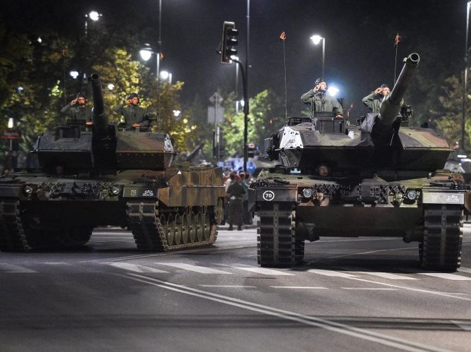 Polish soldiers in tanks during the final rehearsal of a parade prior to Polish Armed Forces Day, in Warsaw, Poland, in the night of 11 to 12 August 2015. Over 700 soldiers, tanks, armoured vehicles, airplanes and helicopters and for the first time Poland's elite counter-terrorism unit GROM along with US soldiers will take part in the Grand Polish Armed Forces Parade which will take place in Warsaw on 15 August. EPA/JACEK TURCZYK POLAND OUT