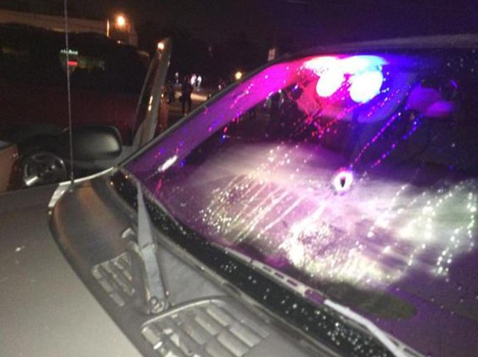 A handout image released by the St. Louis County Police Department on 10 August 2015 showing bullet holes in one of two different unmarked vehicles after a reported shooting involving a St. Louis County Police officer in Ferguson, Missouri, USA, 09 August 2015. A march in Ferguson was disrupted by gunfire on the anniversary of the shooting death of unarmed African-American teenager Michael Brown by white police officer Darren Wilson. Half a dozen shots were heard on footage broadcast by the BBC, prompting hundreds of people to flee the previously peaceful protests. One person was injured, the report said. A policeman came under 'heavy gunfire' that damaged at least two unmarked cars, St Louis Police force said on Twitter. EPA/ST. LOUIS COUNTY POLICE / HANDOUT