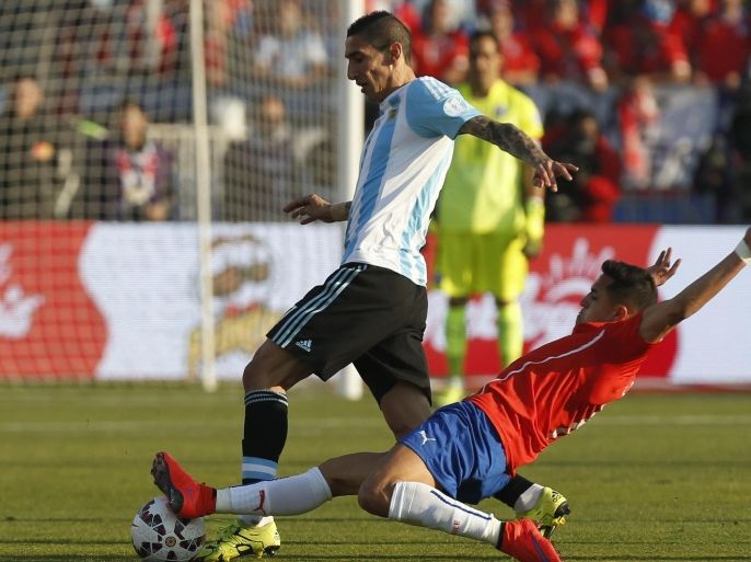 Argentina's Angel Di Maria, left, is tackled by Chile's Alexis Sanchez during the Copa America final soccer match at the National Stadium in Santiago, Chile, Saturday, July 4, 2015. (AP Photo/Luis Hidalgo)
