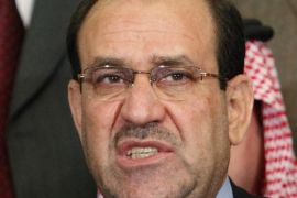FILE - In this Friday, March 26, 2010 file photo, Iraqi Prime Minister Nouri al-Maliki speaks during a news conference in Baghdad, Iraq. The decision by al-Maliki to step down in August 2014 in favor of Haider al-Abadi, a fellow member of his Shiite Islamic Dawa Party, has raised hopes for a more inclusive government that can address Sunni grievances and present a united front against the Islamic extremists. (AP Photo/Hadi Mizban, File)