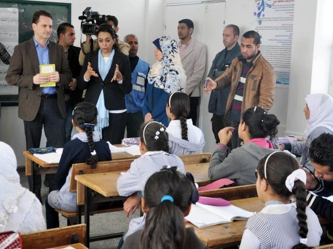 KHAN YUNIS, GAZA - MARCH 22: The United Nations Relief and Works Agency (UNRWA) Commissioner, General Pierre Krenpol (L3), attends the opening ceremony of Huzaa Primary School for girls in Khan Yunis, Gaza on March 22, 2015.
