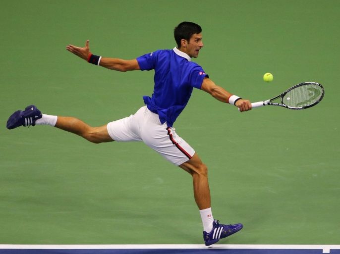 Sep 13, 2015; New York, NY, USA; Novak Djokovic of Serbia hits to Roger Federer of Switzerland on day fourteen of the 2015 U.S. Open tennis tournament at USTA Billie Jean King National Tennis Center. Mandatory Credit: Anthony Gruppuso-USA TODAY Sports