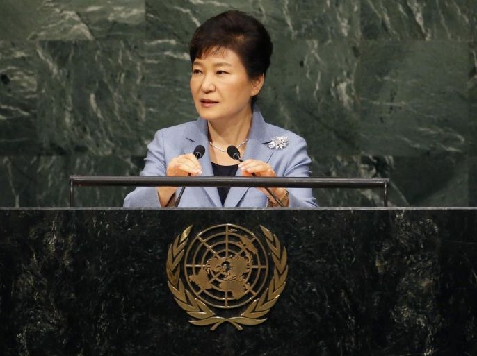 South Korea's President Park Geun-hye adjusts the microphones as she addresses attendees during the 70th session of the United Nations General Assembly at the U.N. headquarters in New York, September 28, 2015. REUTERS/Mike Segar