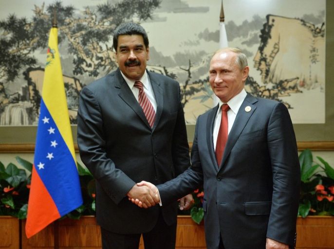 Russian President Vladimir Putin (R) and President of Venezuela Nicolas Maduro (L) meet in the Diaoyutai residence in Beijing after a parade dedicated to the victory of the Chinese people in the Second Sino-Japanese War and the end of WWII in Beijing, China, 03 September 2015. EPA/ALEXEI DRUZHININ/RIA NOVOSTI/KREMLIN POOL MANDATORY CREDIT