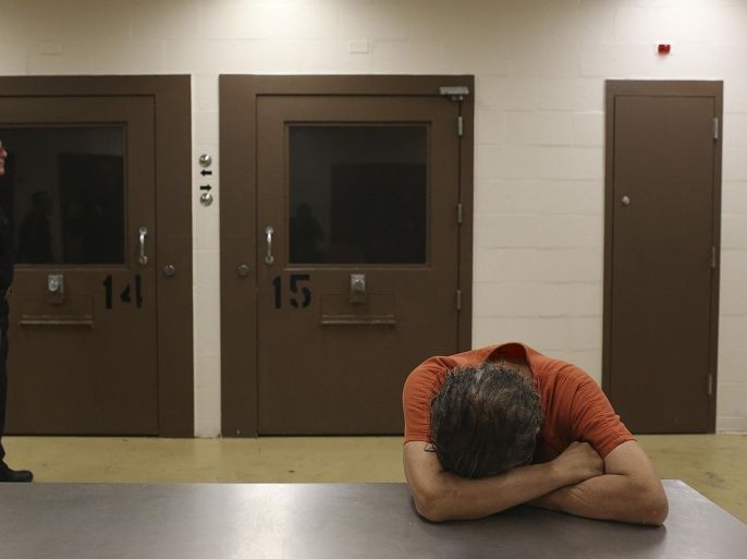 An inmate rests on a table in the Bexar County Jail mental health unit, Tuesday, Aug. 11, 2015 in San Antonio, Texas. The unit was remodeled after officials at the jail commissioned a report from national suicide prevention expert, Lindsay Hayes in 2010. Staff members trained in working with the mentally ill are available 24 hours a day. A deputy and a nurse are on duty seven days a week specifically for suicide prevention, officials said. Also, every inmate receives a mental health assessment when he or she enters the jail, and all deputies receive training on how to spot someone in crisis. (Jerry Lara/The San Antonio Express-News via AP) RUMBO DE SAN ANTONIO OUT; NO SALES; MANDATORY CREDIT