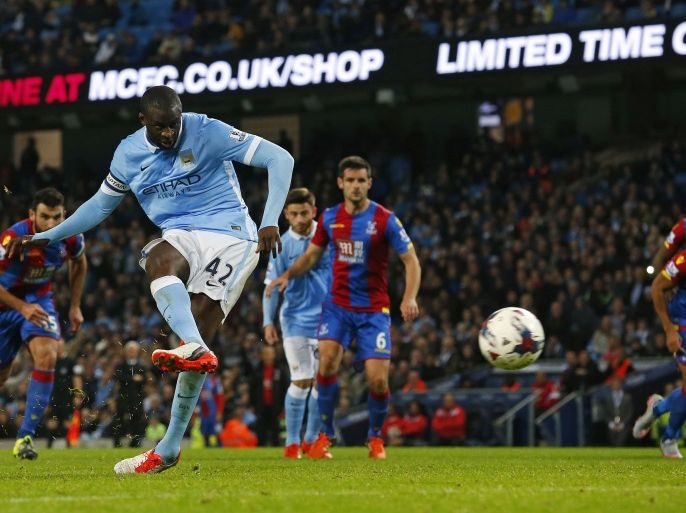 JR155 - Manchester, Greater Manchester, UNITED KINGDOM : Manchester City's Ivorian midfielder and captain Yaya Toure scores their fourth goal from the penalty spot during the English League Cup fourth round football match between Manchester City and Crystal Palace at The Etihad Stadium in Manchester, north west England on October 28, 2015. AFP PHOTO / LINDSEY PARNABY