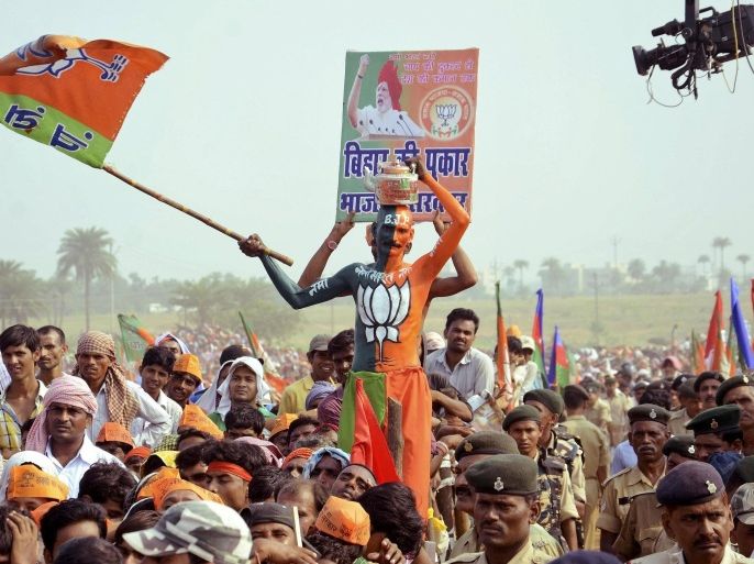 A supporter of India's ruling Bharatiya Janata Party (BJP) waves the party flag during an election campaign rally addressed by India's Prime Minister Narendra Modi (not pictured) in Banka, in the eastern state of Bihar October 2, 2015. Indian Prime Minister Narendra Modi is on the campaign trail in a state election that could define the rest of his term, promising jobs and development in one of the country's most backward areas, while his right-wing party pushes a Hindu agenda. Braving the scorching sun, thousands of men and women clad in bright shirts and saris trudged miles to Modi's campaign rally last week in the state of Bihar. Voting to the legislature there will start on Monday and the result will be out on Nov. 8. To match story INDIA-ELECTION/MODI Picture taken October 2, 2015. REUTERS/Stringer