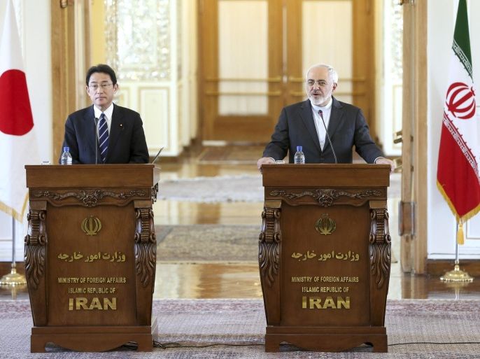 Iranian Foreign Minister Mohammad Javad Zarif, right, speaks during a press briefing with his Japanese counterpart Fumio Kishida after their talks in Tehran, Iran, Monday, Oct. 12, 2015. (AP Photo/Ebrahim Noroozi)