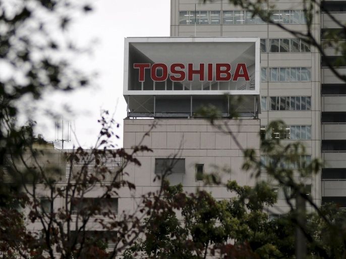 The logo of Toshiba Corp is seen behind trees at its headquarters in Tokyo, Japan in this October 1, 2015 file photo. REUTERS/Toru Hanai/Files