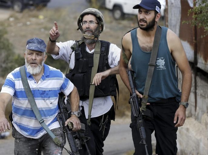 Israeli settlers gather at the scene of an attack in the West Bank settlement of Qiriat Arba, near Hebron, 09 October 2015. According to reports, a Palestinian man was shot and wounded after he stabbed an Israeli police officer. Violence has been ongoing in the region for weeks, focused on Jerusalem and nearby areas on the West Bank amid rising concerns the situation could lead to an even greater escalation if not scaled back soon.