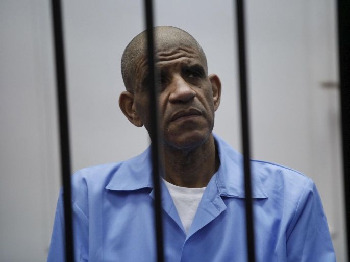 Abdullah al-Senussi , ex-spy chief in Muammar Gaddafi's government, sits behind bars during a hearing at a courtroom in Tripoli in this May 25, 2014 file photo. A Libyan court passed a death sentence in absentia on Muammar Gaddafi's most prominent son, Saif al-Islam, on Tuesday for suppressing peaceful protests during the country's 2011 revolution that ended his father's rule. The court also handed down in a televised session a death sentence by firing squad to Gaddafi's former spy chief, Abdullah al-Senussi, and his former prime minister, Baghdadi al-Mahmoudi. REUTERS/Ismail Zitouny/Files